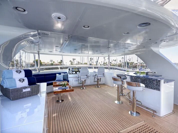 a room with a pool table and chairs aboard NEW JOURNEY Yacht for Sale