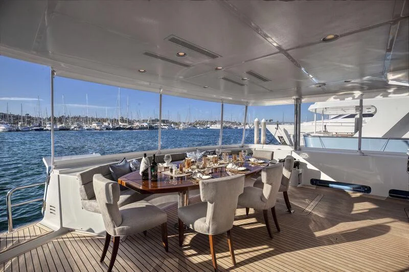 a table on a deck overlooking the ocean aboard NEW JOURNEY Yacht for Sale