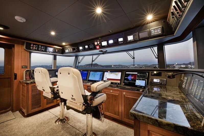 a room with a desk and chairs aboard NEW JOURNEY Yacht for Sale