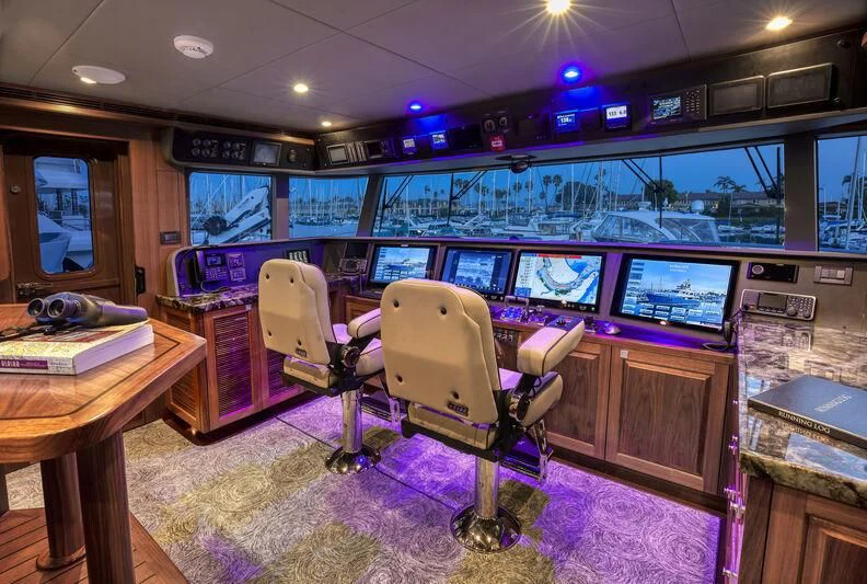 a room with a desk and chairs aboard NEW JOURNEY Yacht for Sale