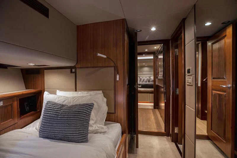 a bedroom with a bed and a closet aboard NEW JOURNEY Yacht for Sale