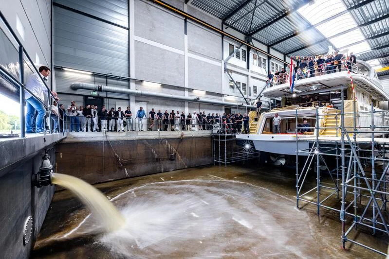 a large group of people on a boat in a large building aboard SEAFLOWER Yacht for Sale
