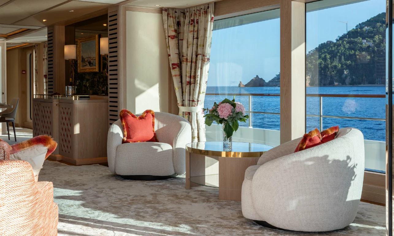 a living room with a large window aboard SEAFLOWER Yacht for Sale