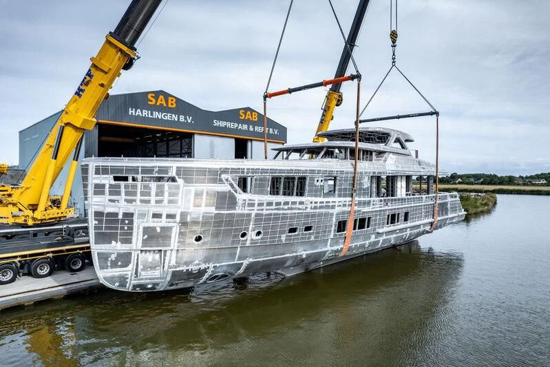 a large white boat with a crane on the front aboard SEAFLOWER Yacht for Sale