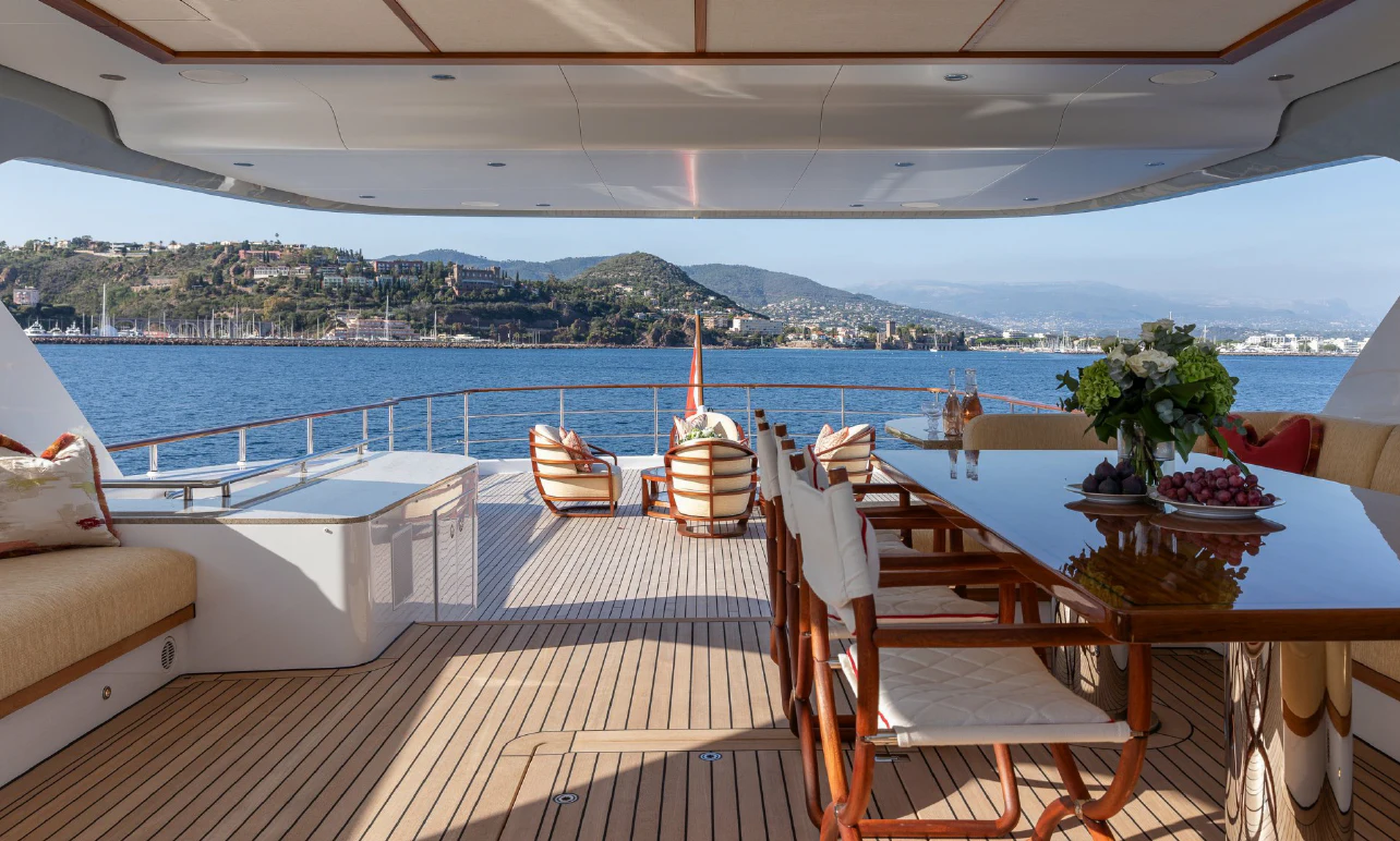 a deck with chairs and tables on it aboard SEAFLOWER Yacht for Sale