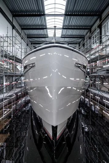 a large silver ball in a large room with glass walls aboard SEAFLOWER Yacht for Sale