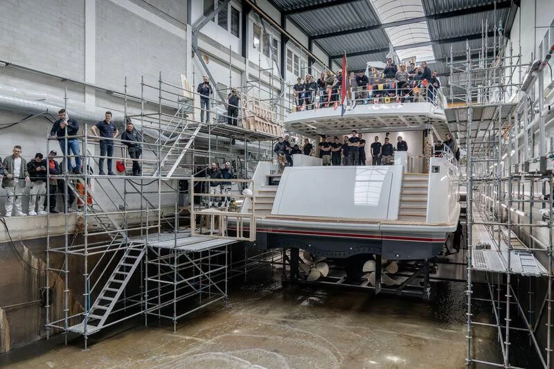 a group of people in a factory aboard SEAFLOWER Yacht for Sale