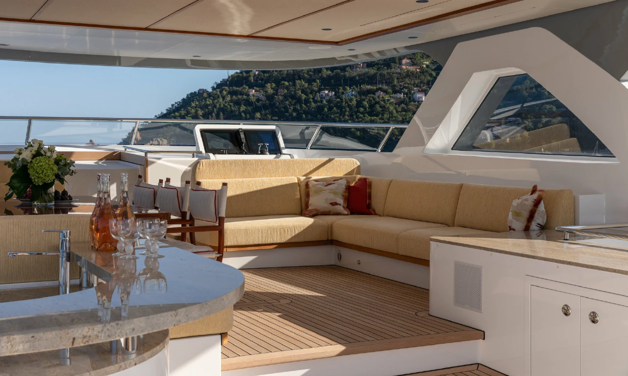 a living room with a couch and a table aboard SEAFLOWER Yacht for Sale