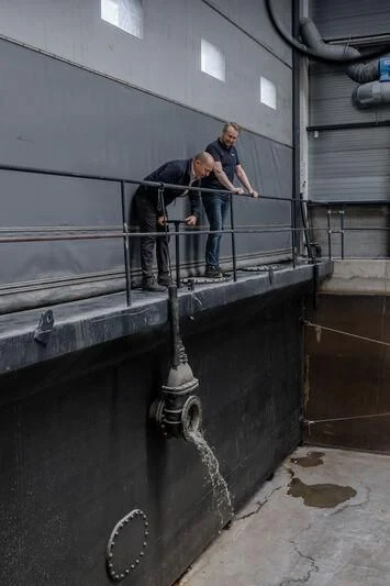 a man standing on a metal railing aboard SEAFLOWER Yacht for Sale
