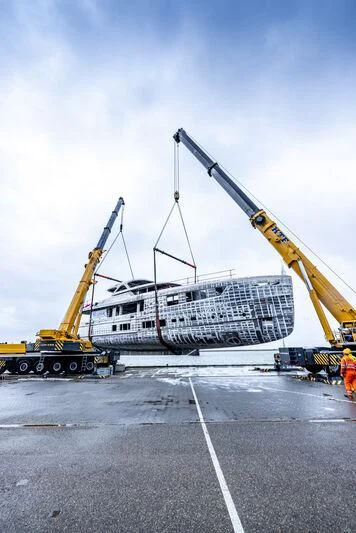 a large white ship with a crane aboard SEAFLOWER Yacht for Sale