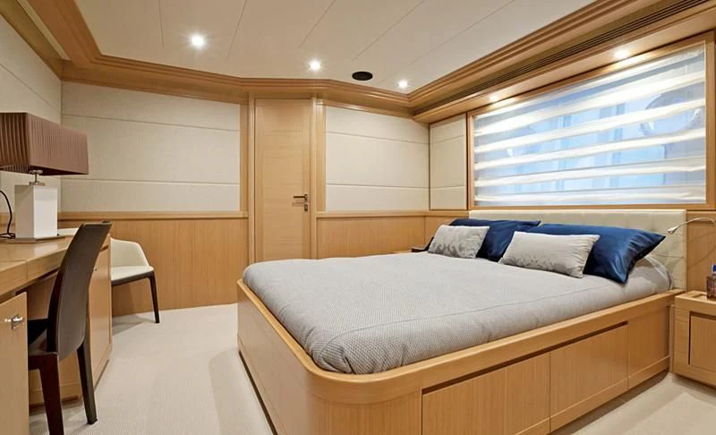 a bed in a room aboard LA PAUSA Yacht for Sale