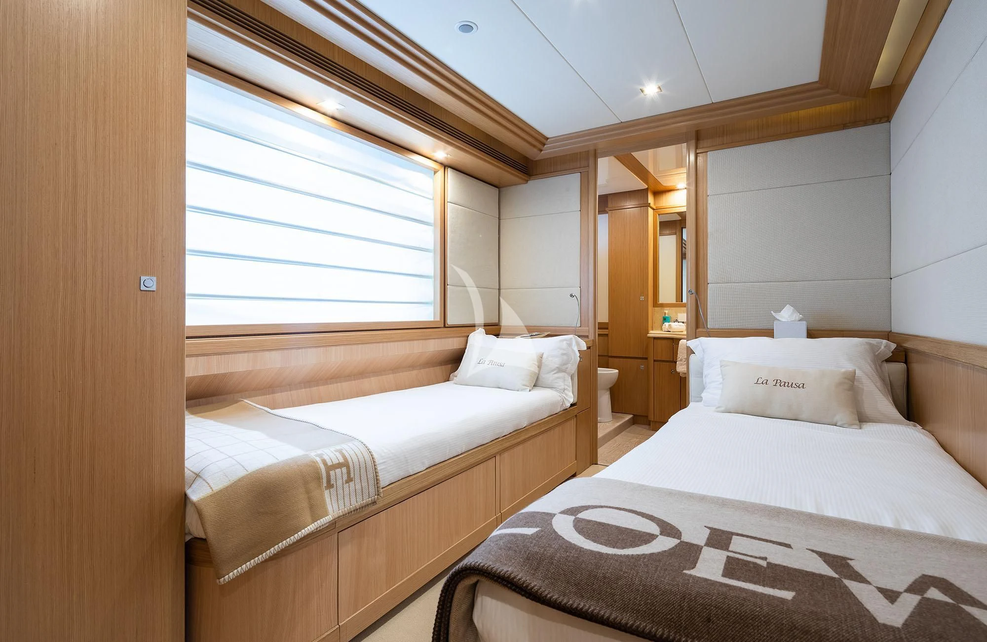 a couple of beds in a room aboard LA PAUSA Yacht for Sale