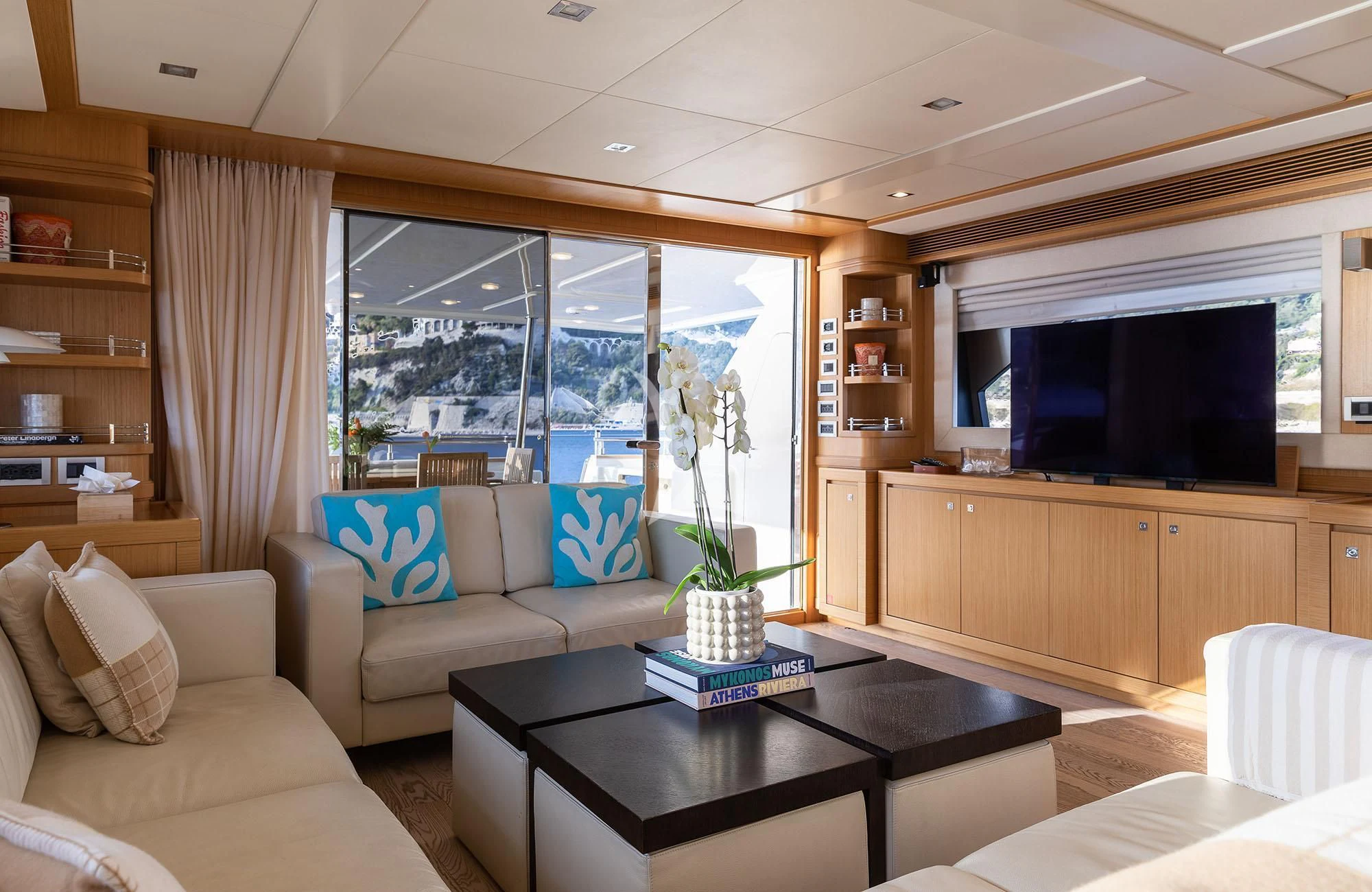 a living room with a large window aboard LA PAUSA Yacht for Sale