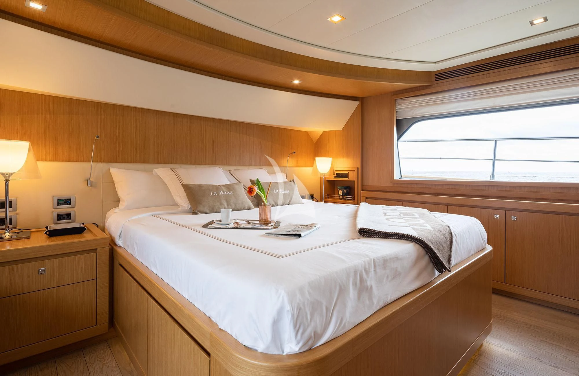 a bed with a white bed spread aboard LA PAUSA Yacht for Sale
