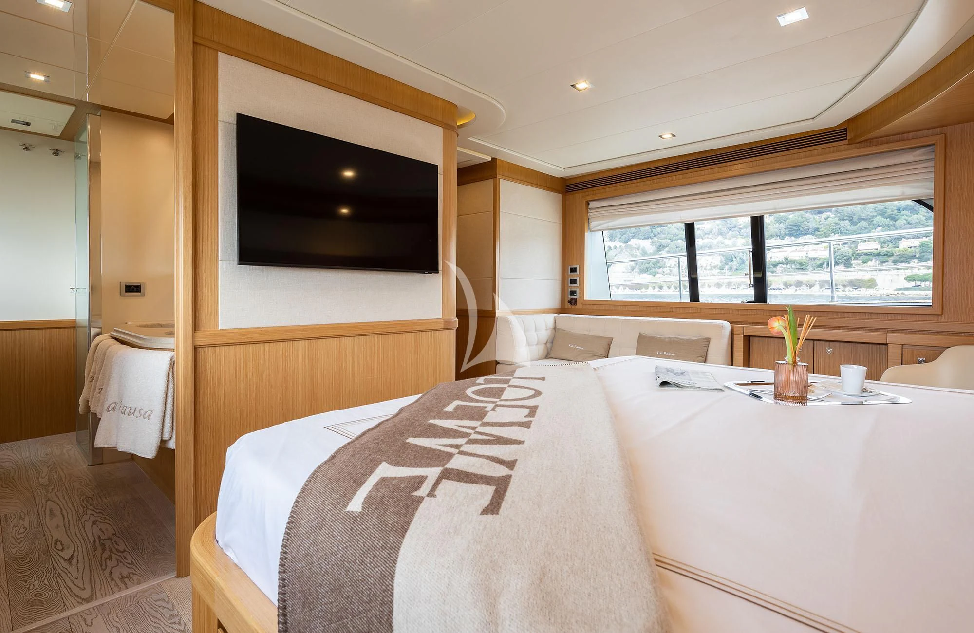 a hotel room with a bed and a television aboard LA PAUSA Yacht for Sale