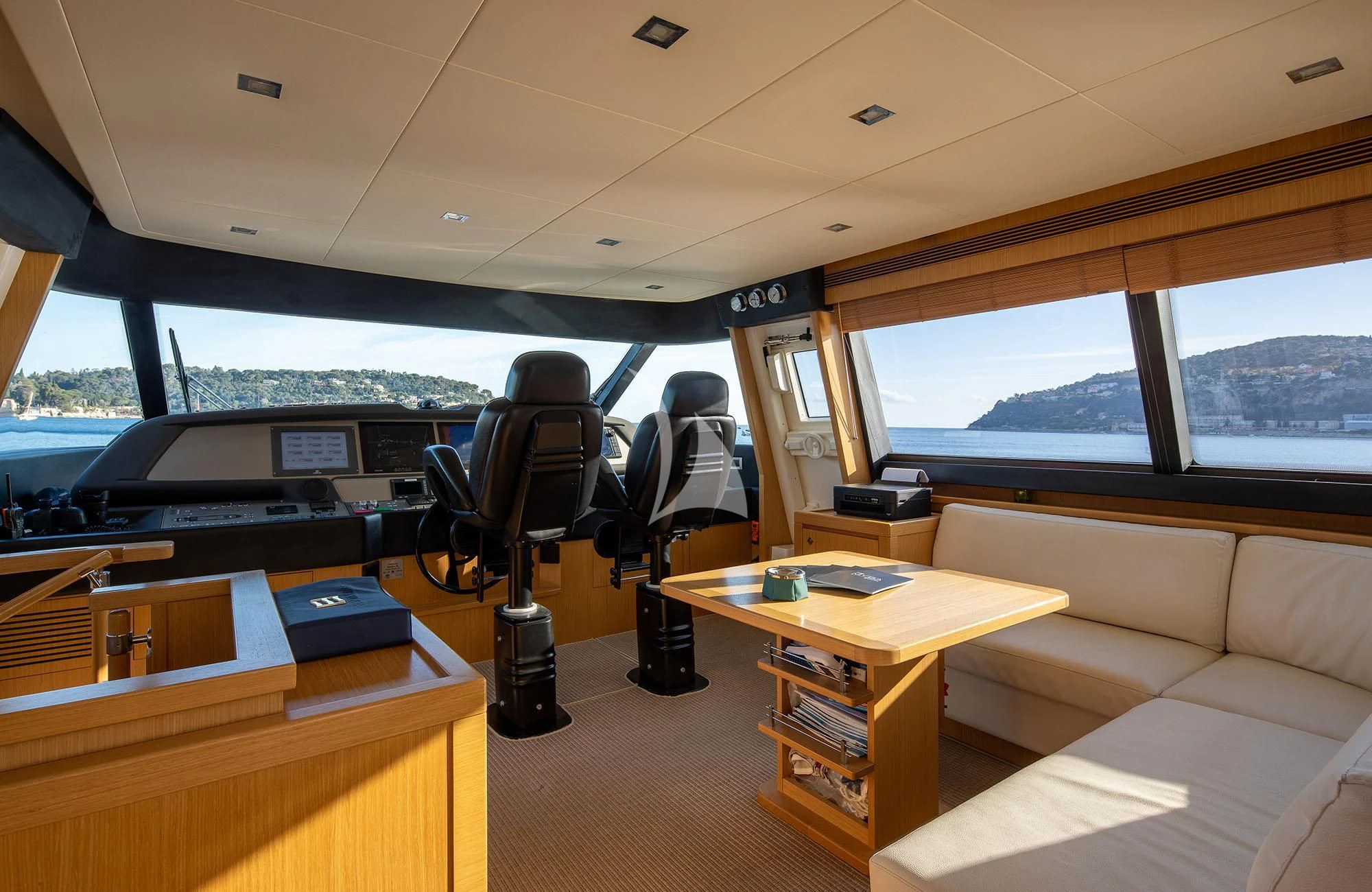 inside of a vehicle with a desk and a chair aboard LA PAUSA Yacht for Sale