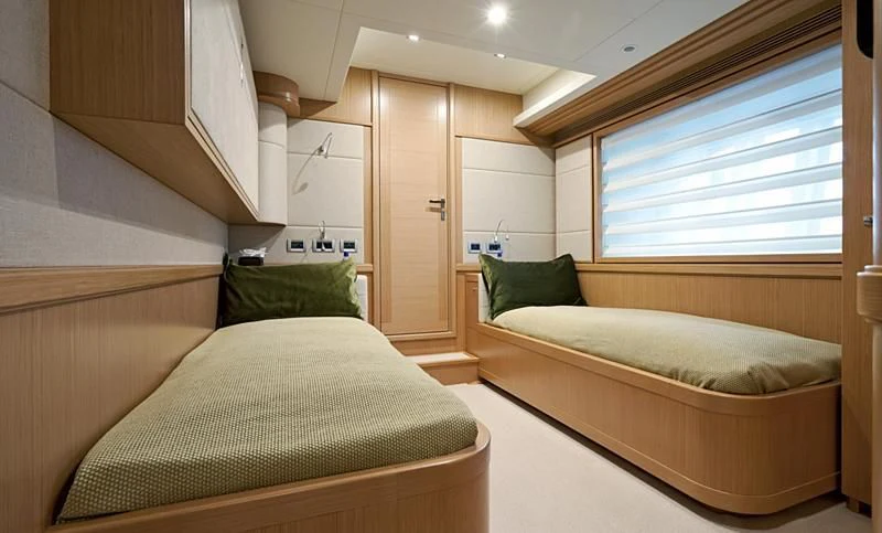 a room with two beds aboard LA PAUSA Yacht for Sale
