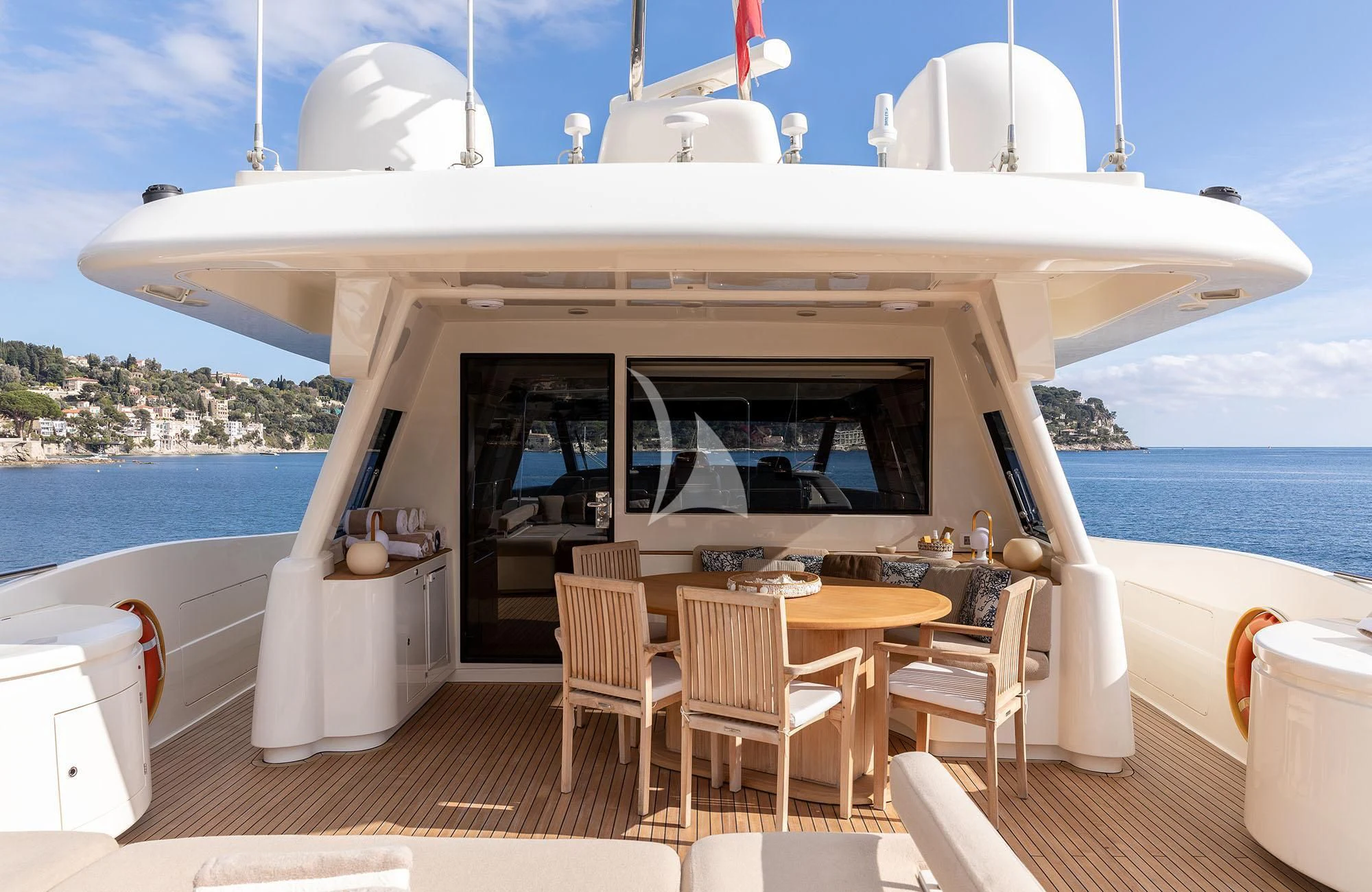 a boat with a table and chairs aboard LA PAUSA Yacht for Sale
