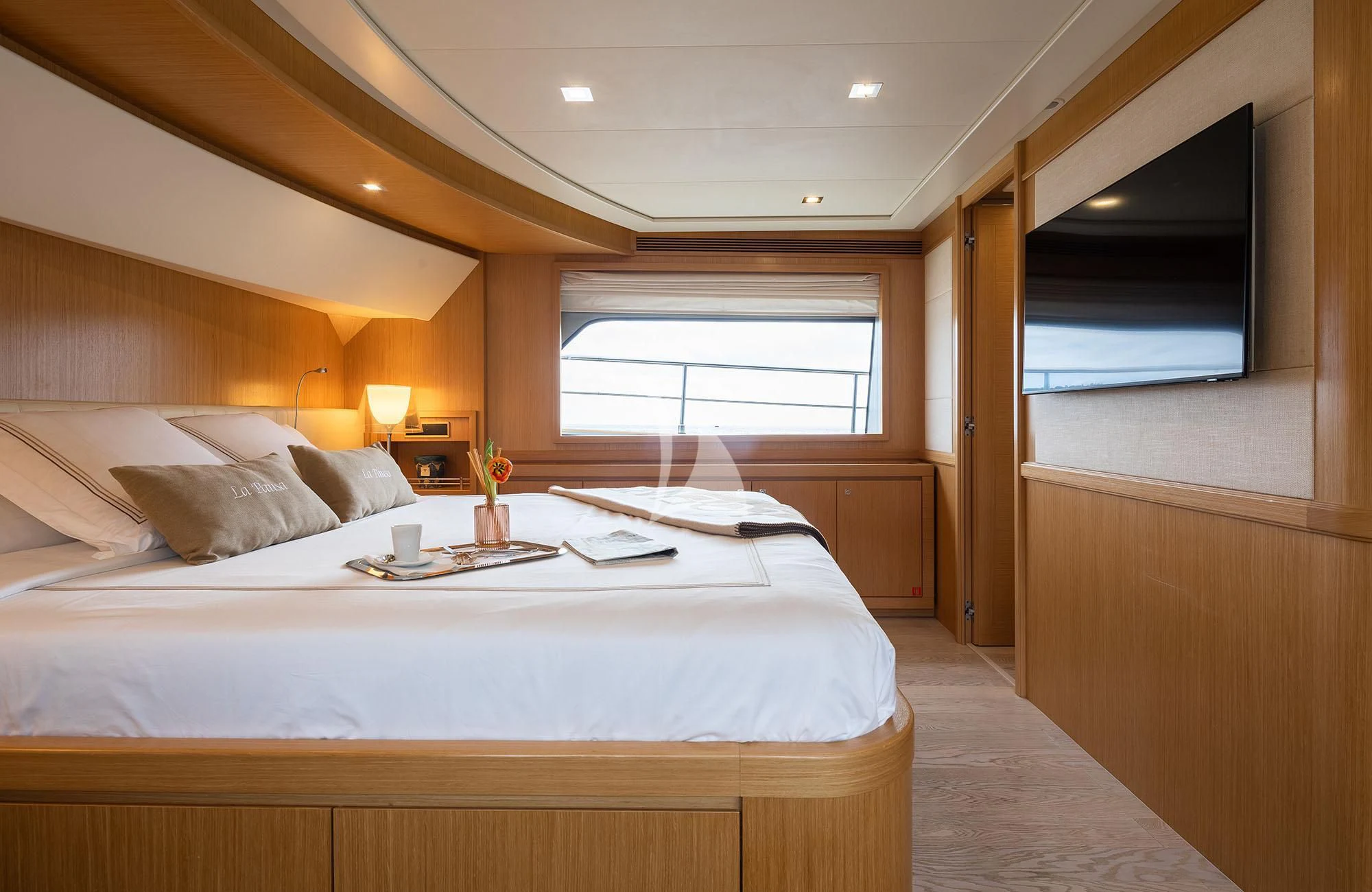 a bed with a white sheet and a white bed spread aboard LA PAUSA Yacht for Sale