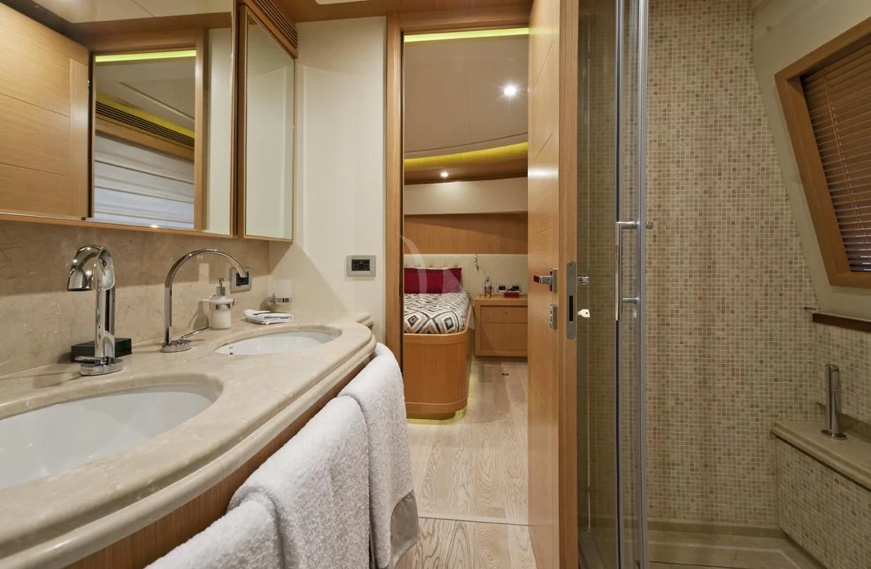 a bathroom with a sink and a mirror aboard LA PAUSA Yacht for Sale