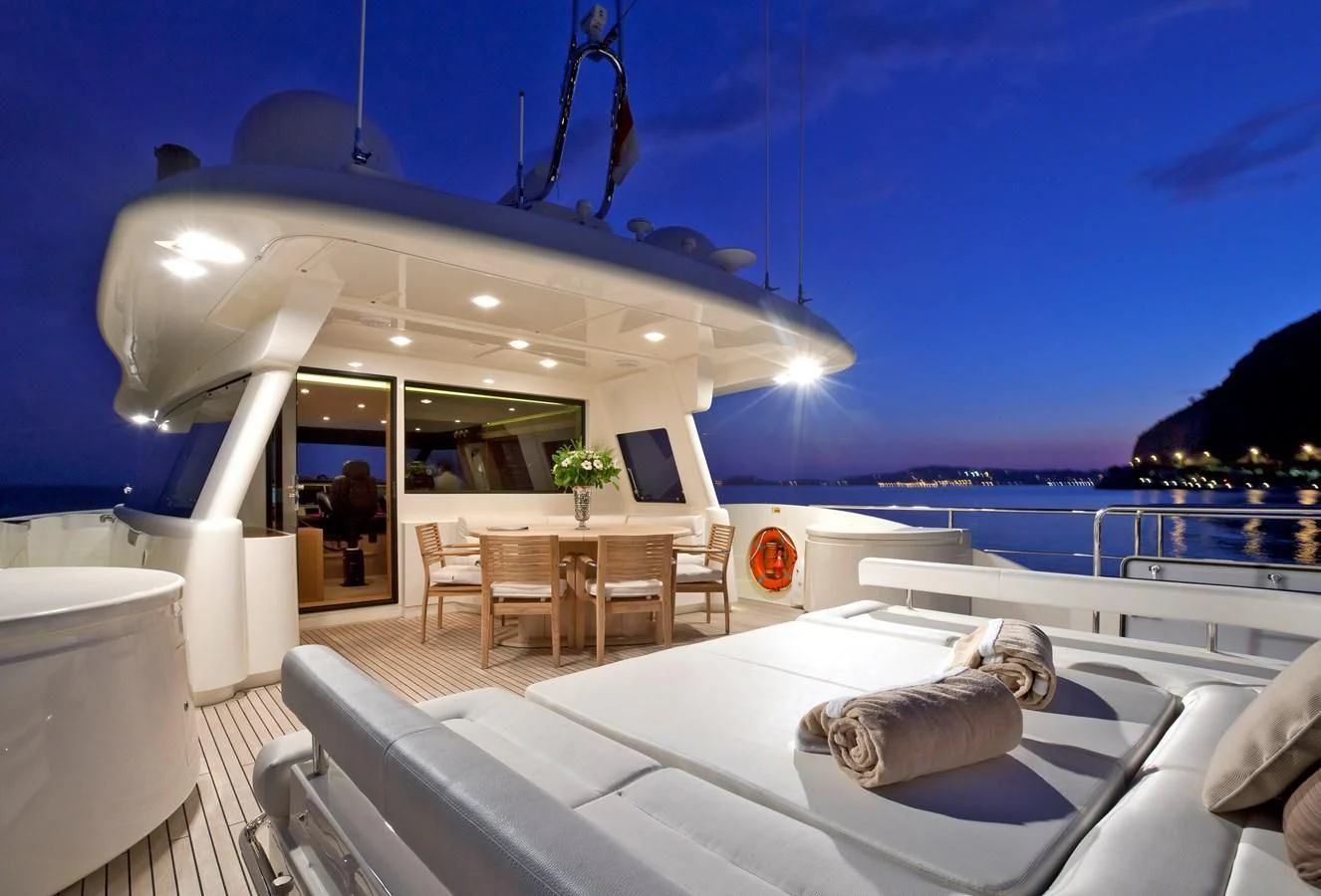 a large white lounge chair on a yacht with a large white lounge chair and a large white lounge aboard LA PAUSA Yacht for Sale