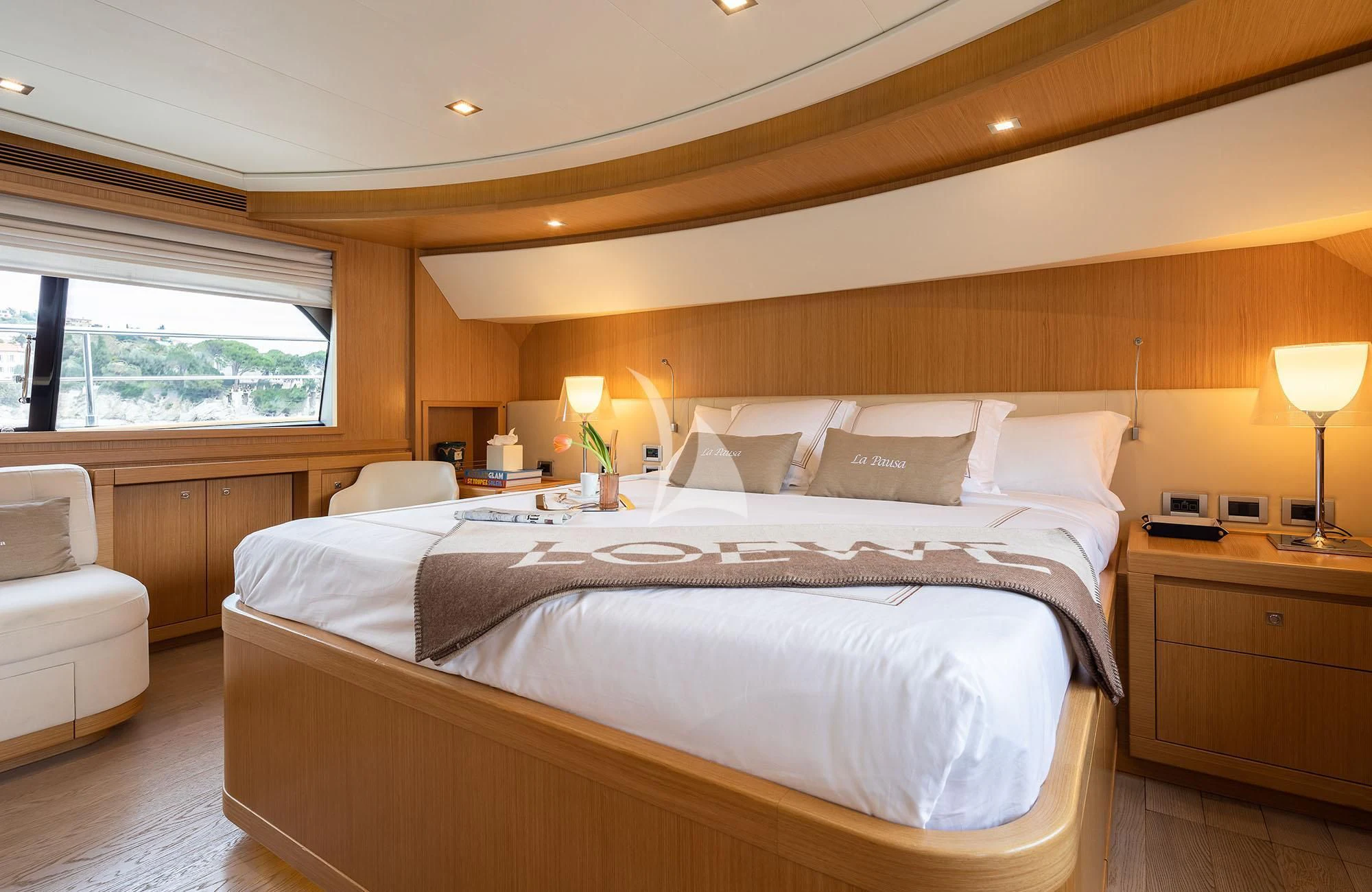 a bed with white sheets aboard LA PAUSA Yacht for Sale