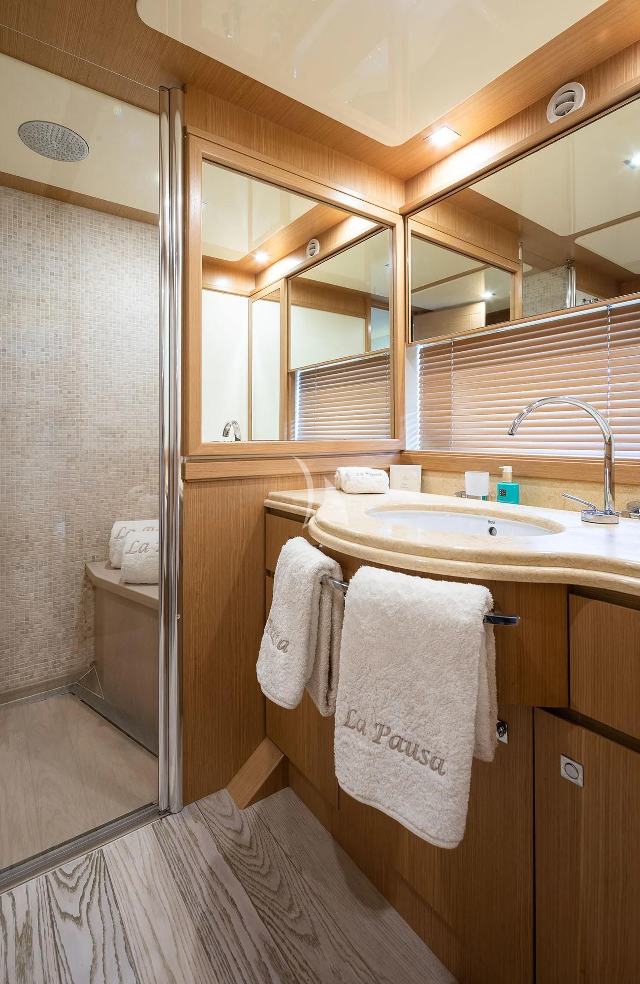 a bathroom with a sink and a mirror aboard LA PAUSA Yacht for Sale