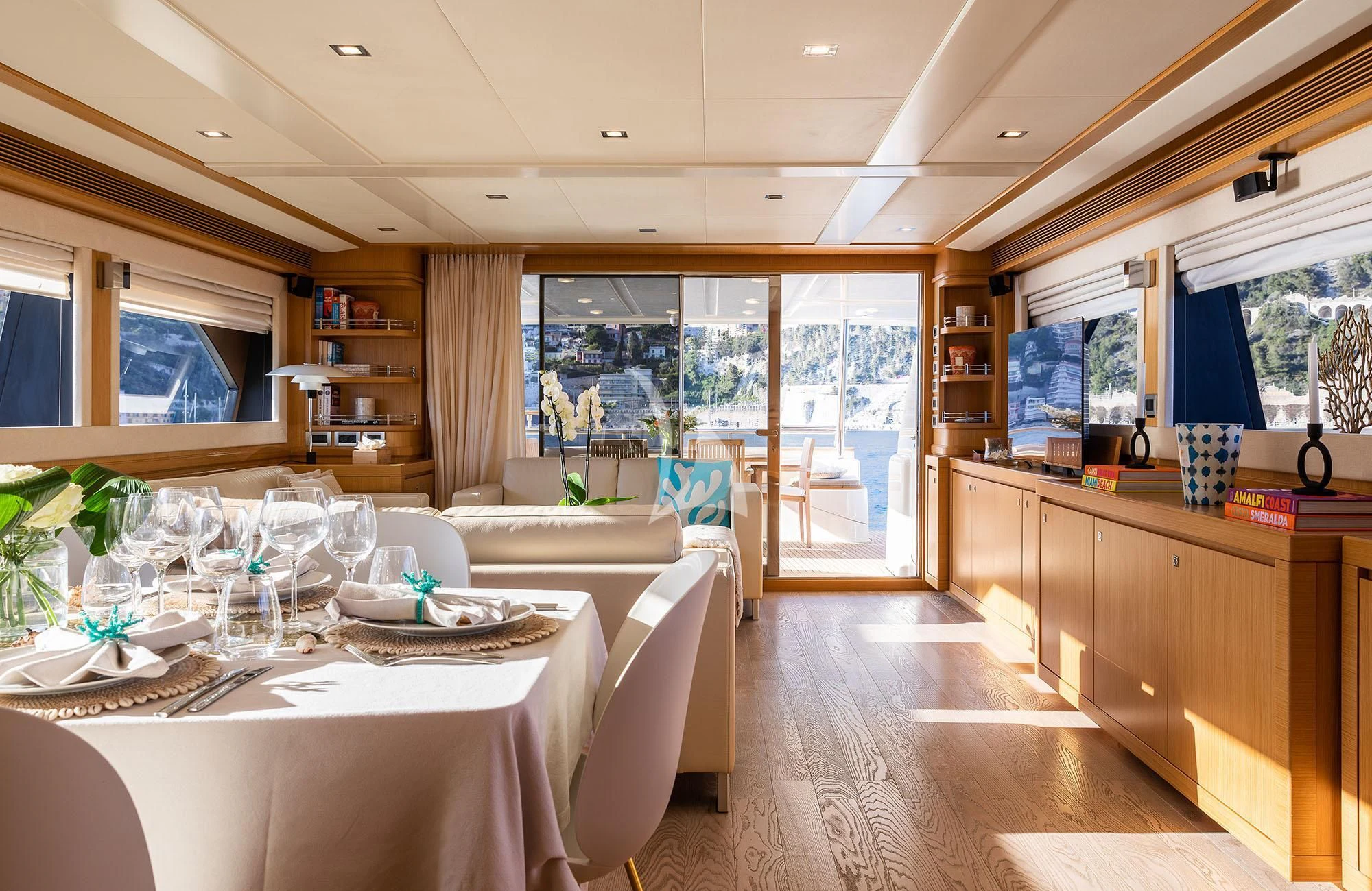 a large dining room with a large window aboard LA PAUSA Yacht for Sale