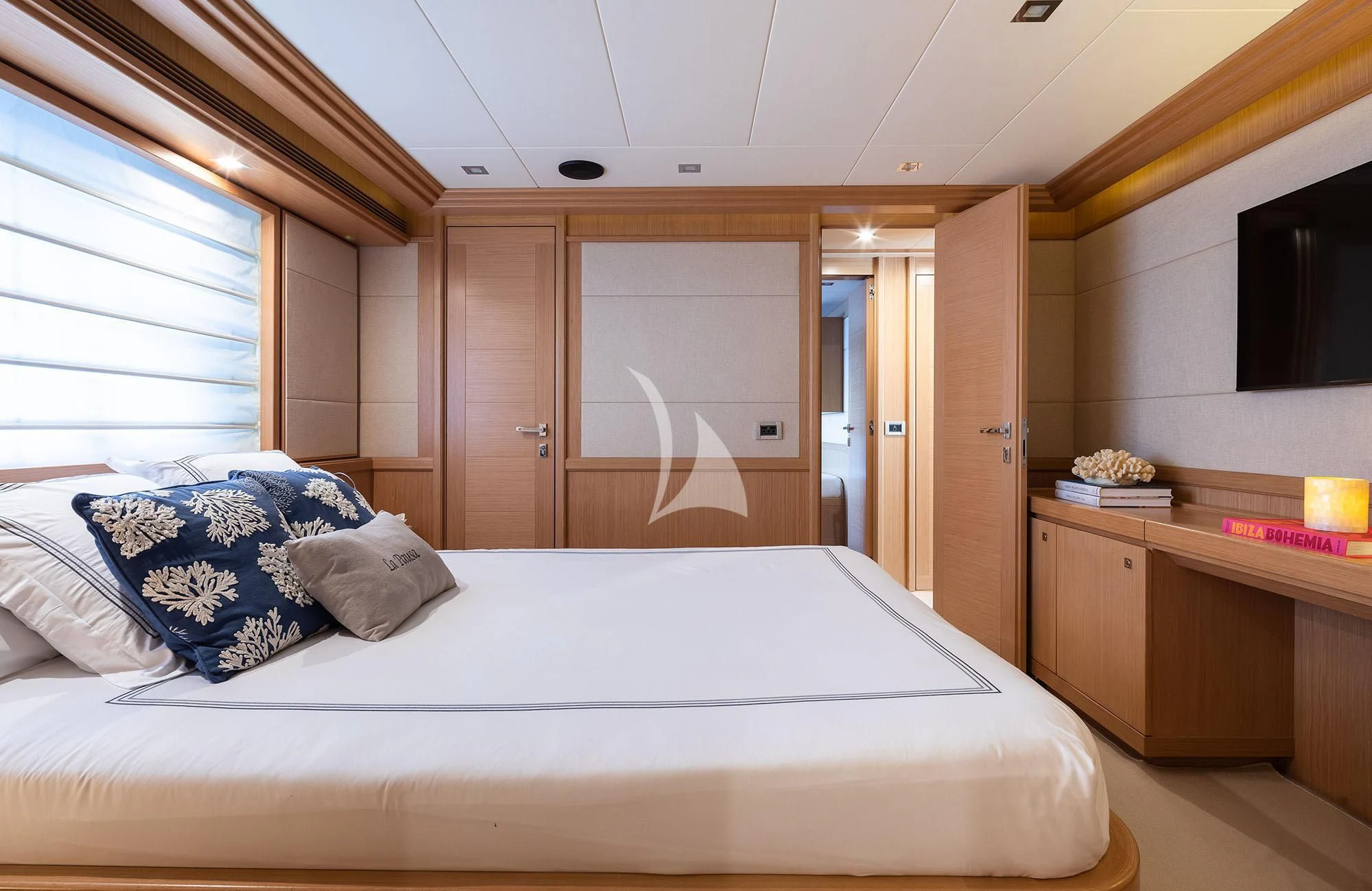 a bedroom with a bed and a tv aboard LA PAUSA Yacht for Sale
