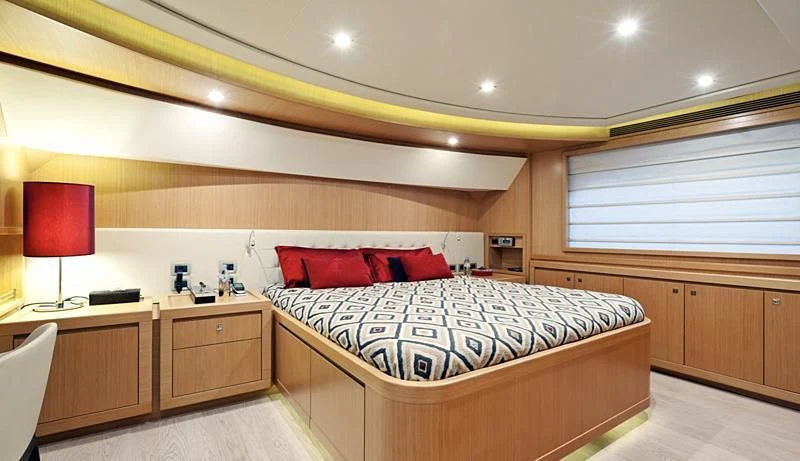 a room with a bed and desk aboard LA PAUSA Yacht for Sale
