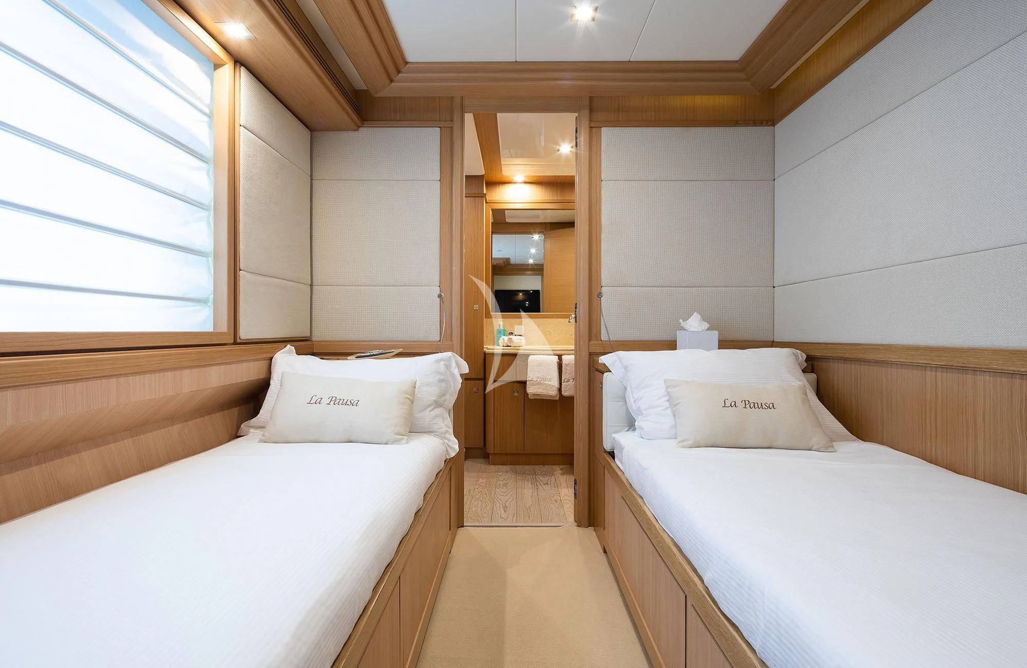 a room with two beds aboard LA PAUSA Yacht for Sale