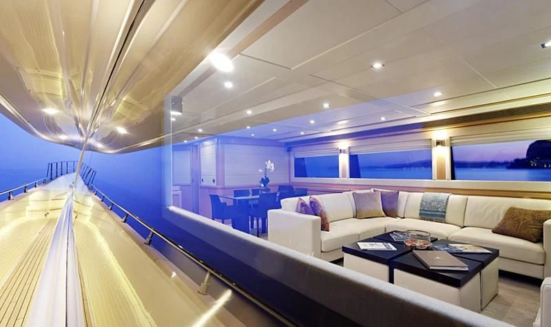 a room with a couch and a table aboard LA PAUSA Yacht for Sale
