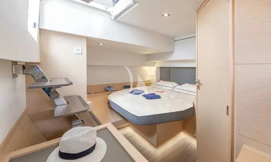 a room with a bed and a hat aboard CHILOE Yacht for Charter