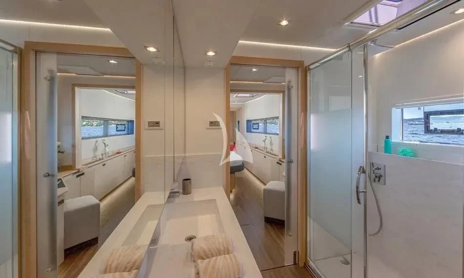 a large bathroom with a large glass shower aboard CHILOE Yacht for Charter