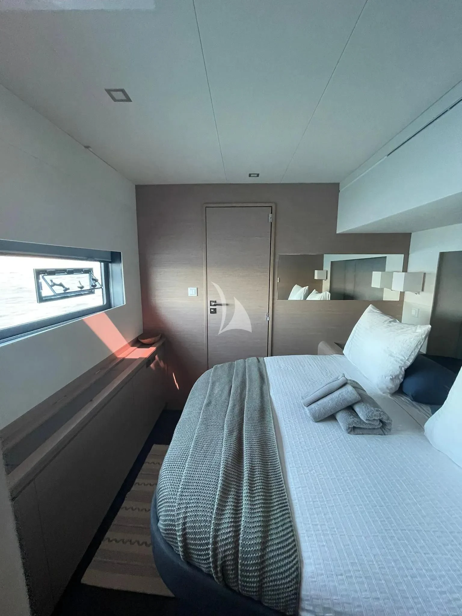 a bed in a room aboard CHILOE Yacht for Charter