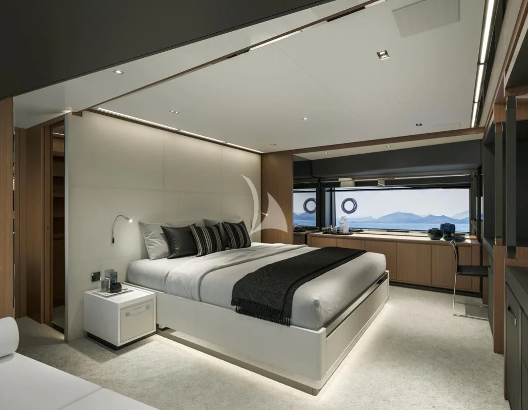 a bedroom with a large bed aboard G Yacht for Sale