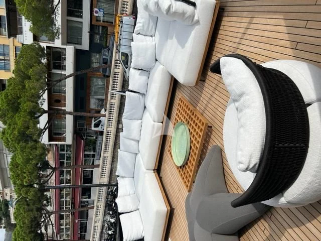 a large sculpture of a person wearing a hat and sunglasses aboard G Yacht for Sale