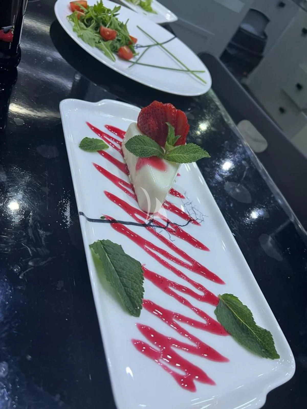 a table with plates of food on it aboard G Yacht for Sale