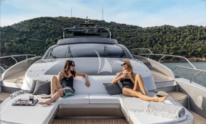 two women sitting on a boat aboard G Yacht for Sale