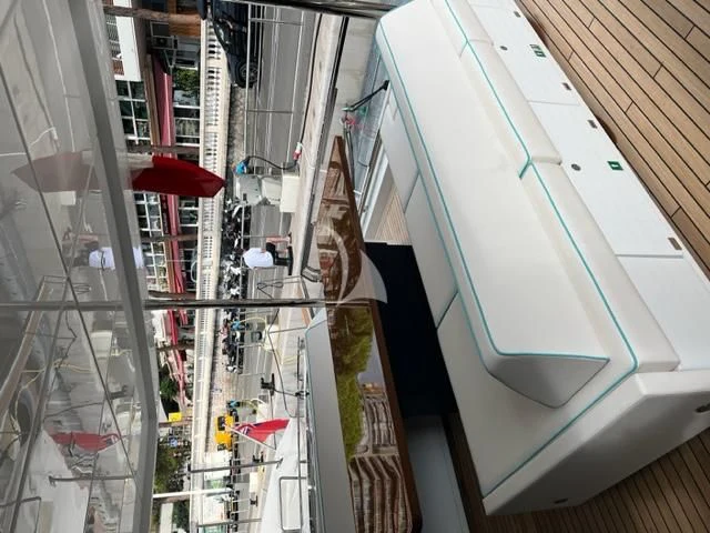 a street with cars and people aboard G Yacht for Sale