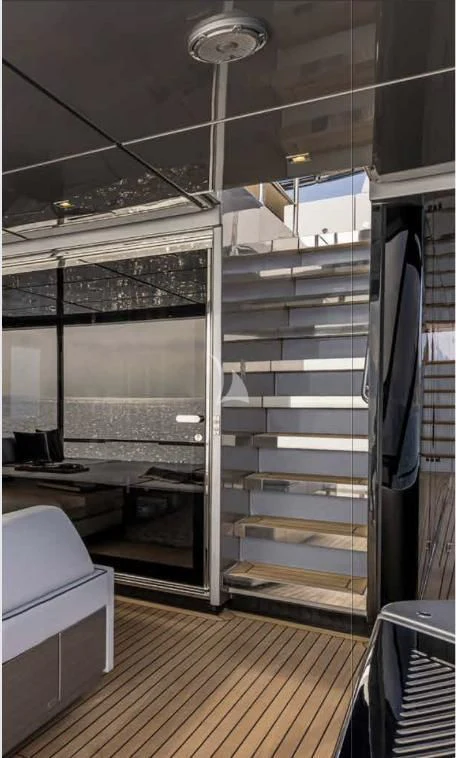 a room with a glass wall aboard G Yacht for Sale