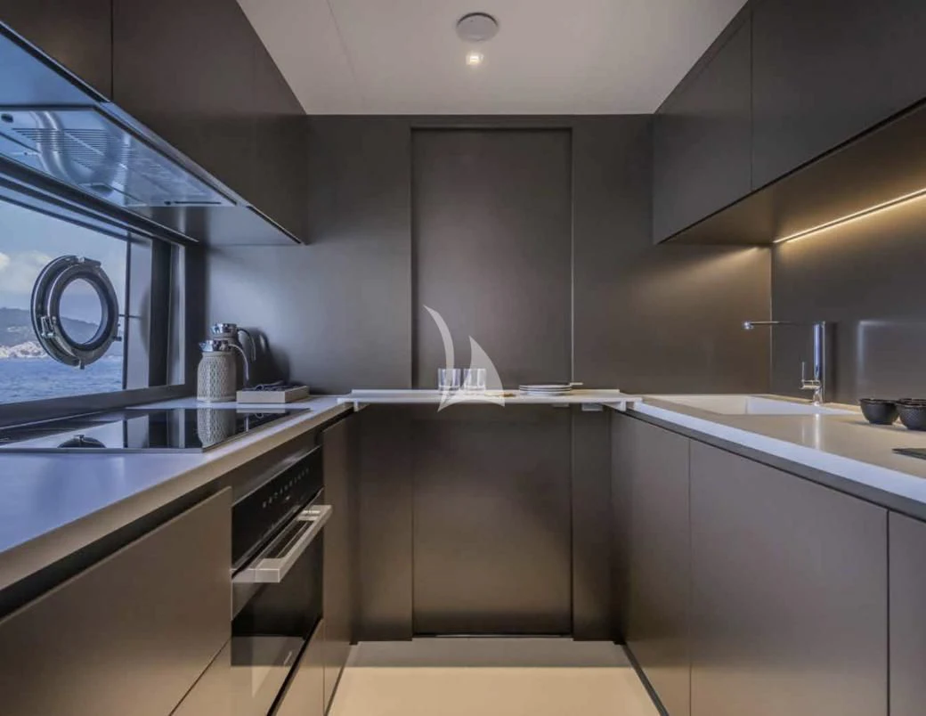 a kitchen with stainless steel appliances aboard G Yacht for Sale