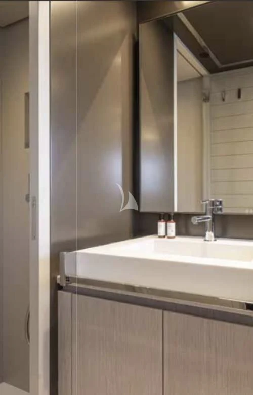 a bathroom with a sink and a mirror aboard G Yacht for Sale