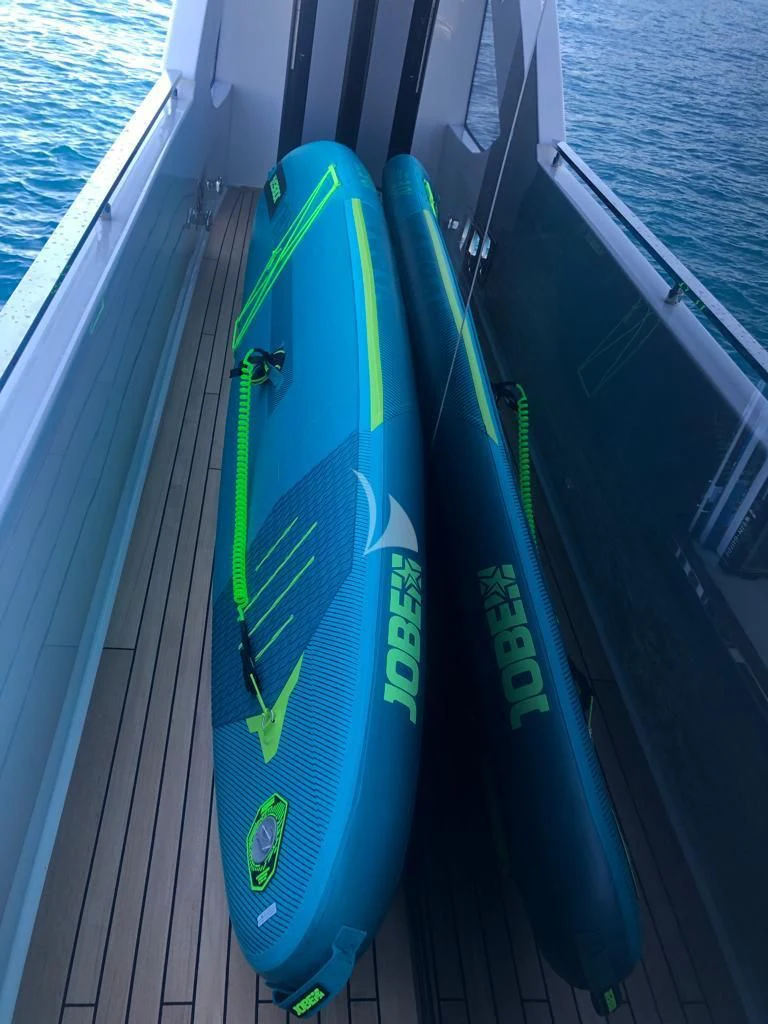 a pair of surfboards on a boat aboard G Yacht for Sale