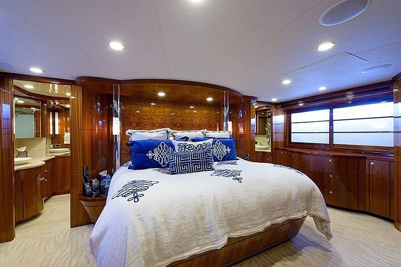 a bedroom with a large bed aboard MI AMOR II Yacht for Sale