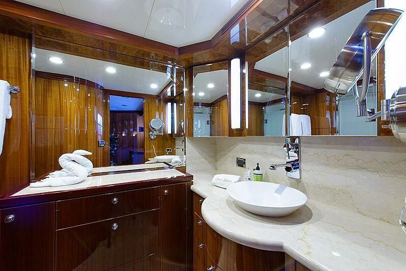 a bathroom with a large mirror aboard MI AMOR II Yacht for Sale