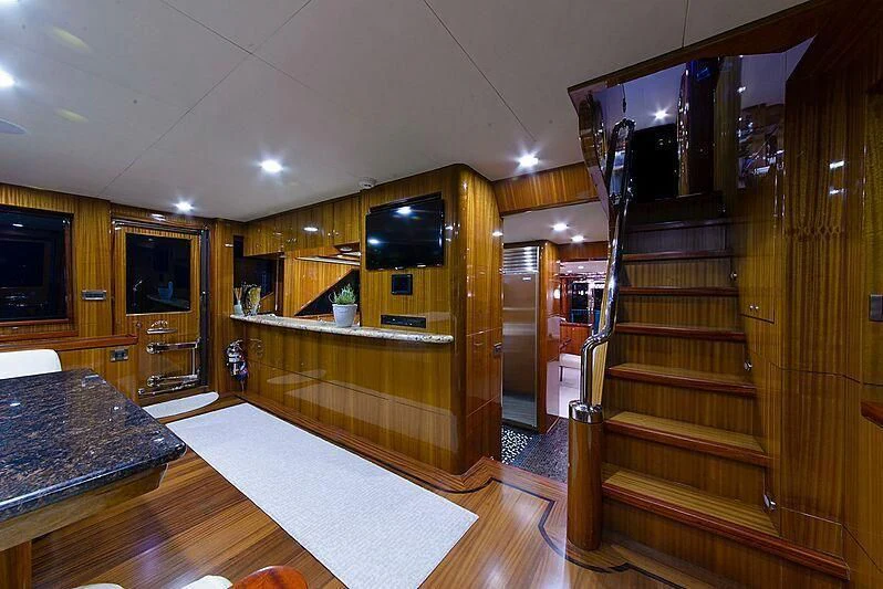 a large kitchen with a large wooden cabinet aboard MI AMOR II Yacht for Sale