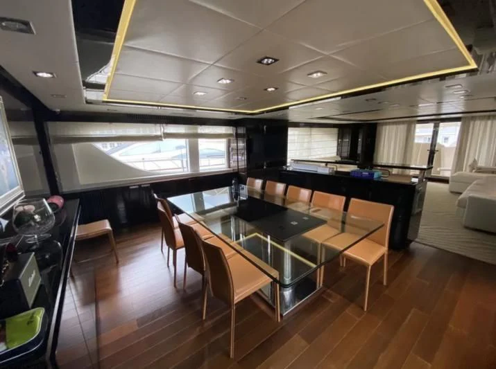 a room with a table and chairs aboard WHITE PEARL Yacht for Sale