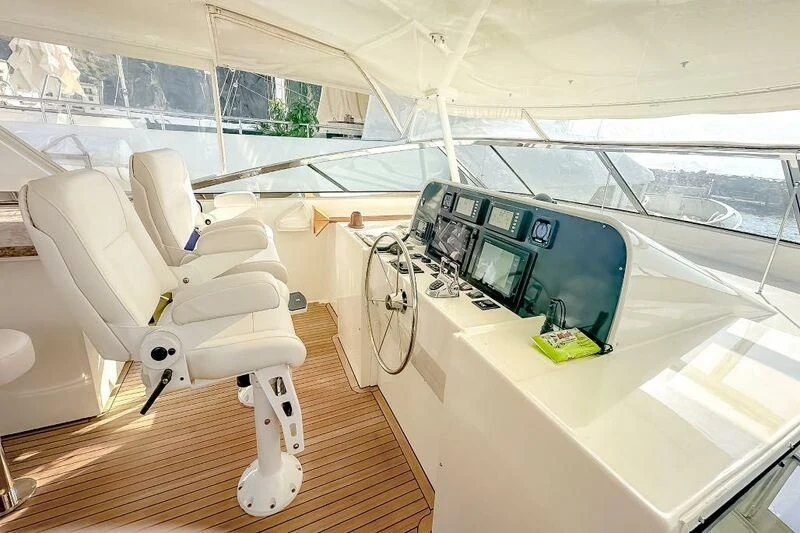 a white chair in a room aboard JULE Yacht for Sale