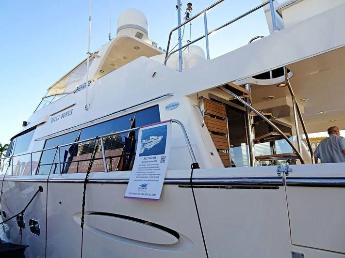 a boat with a sign on the front aboard JULE Yacht for Sale